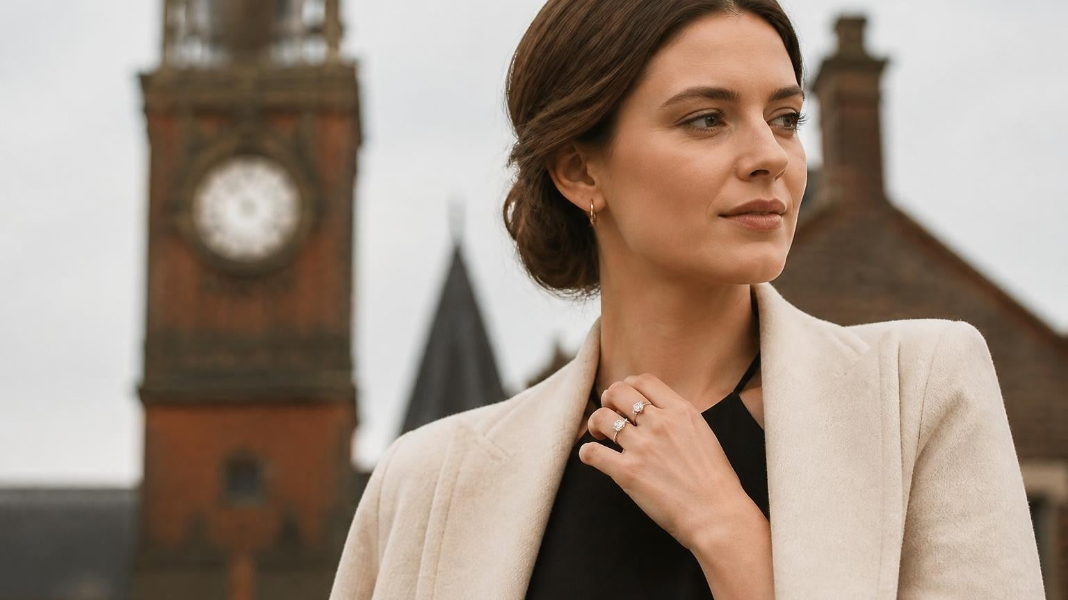 Best engagement rings in Birmingham — elegant British woman with Satéur Destinée Ring, Jewellery Quarter Victorian clock tower