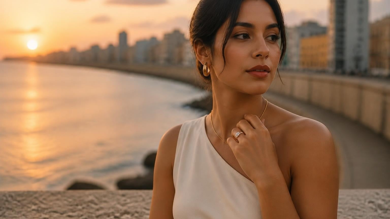 Best engagement rings in Cuba — Cuban woman with solitaire ring at Havana Malecón sunset