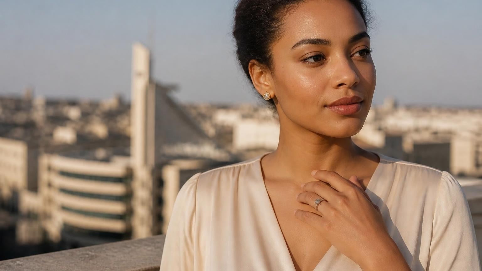 Best engagement rings in Eritrea — woman with Satéur Destinée Ring, Asmara Art Deco skyline