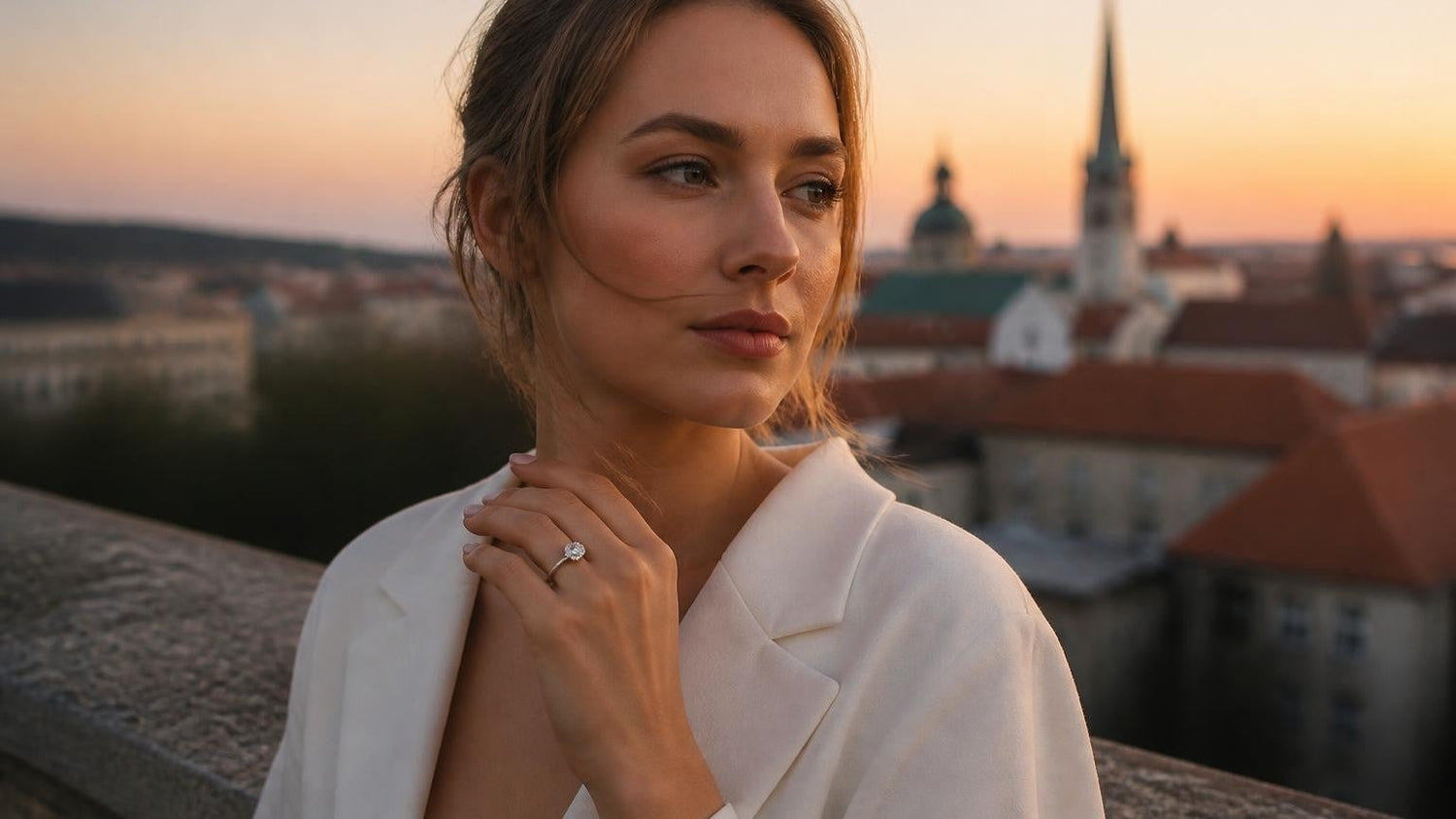 Best engagement rings in Estonia — elegant woman with solitaire ring, Tallinn Old Town at sunset