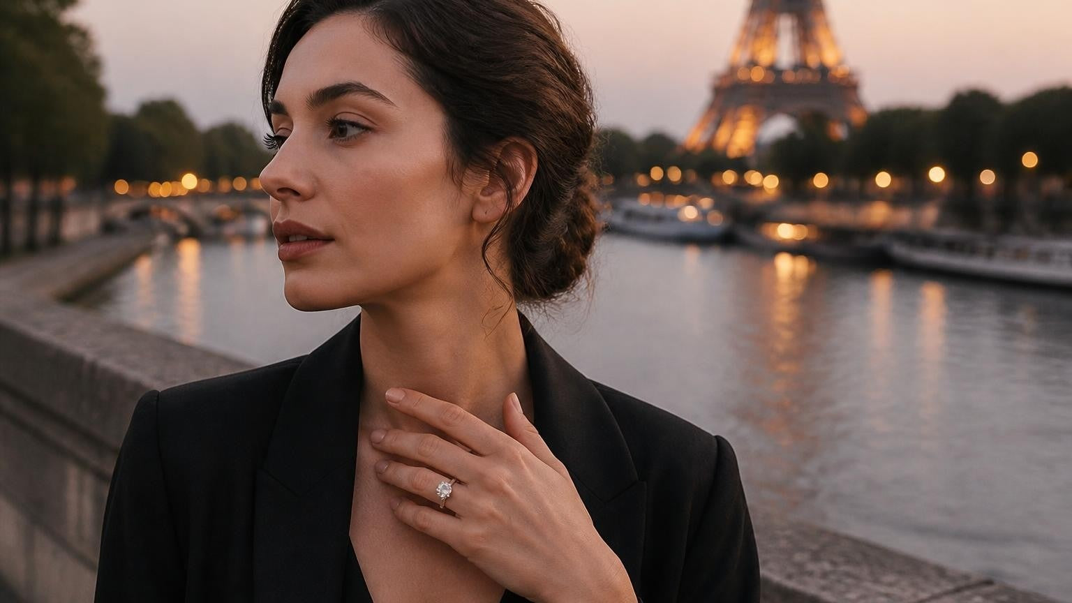 Satéur Destinée Ring on the finger of an elegant French woman by the Seine, Eiffel Tower glowing softly at dusk — best engagement rings in France