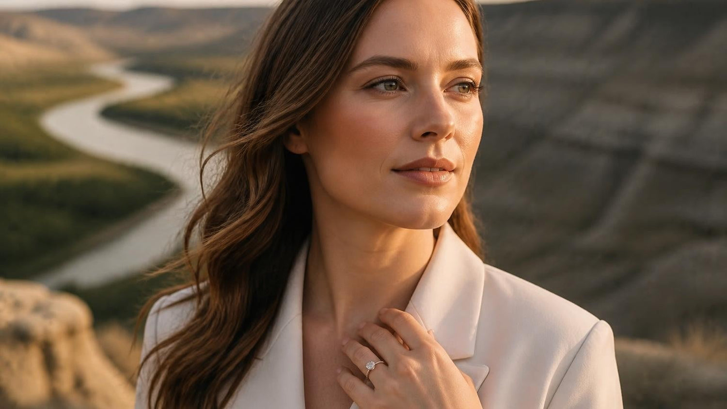 Best engagement rings in Medicine Hat — elegant woman with Satéur Destinée solitaire ring, South Saskatchewan River valley at golden hour