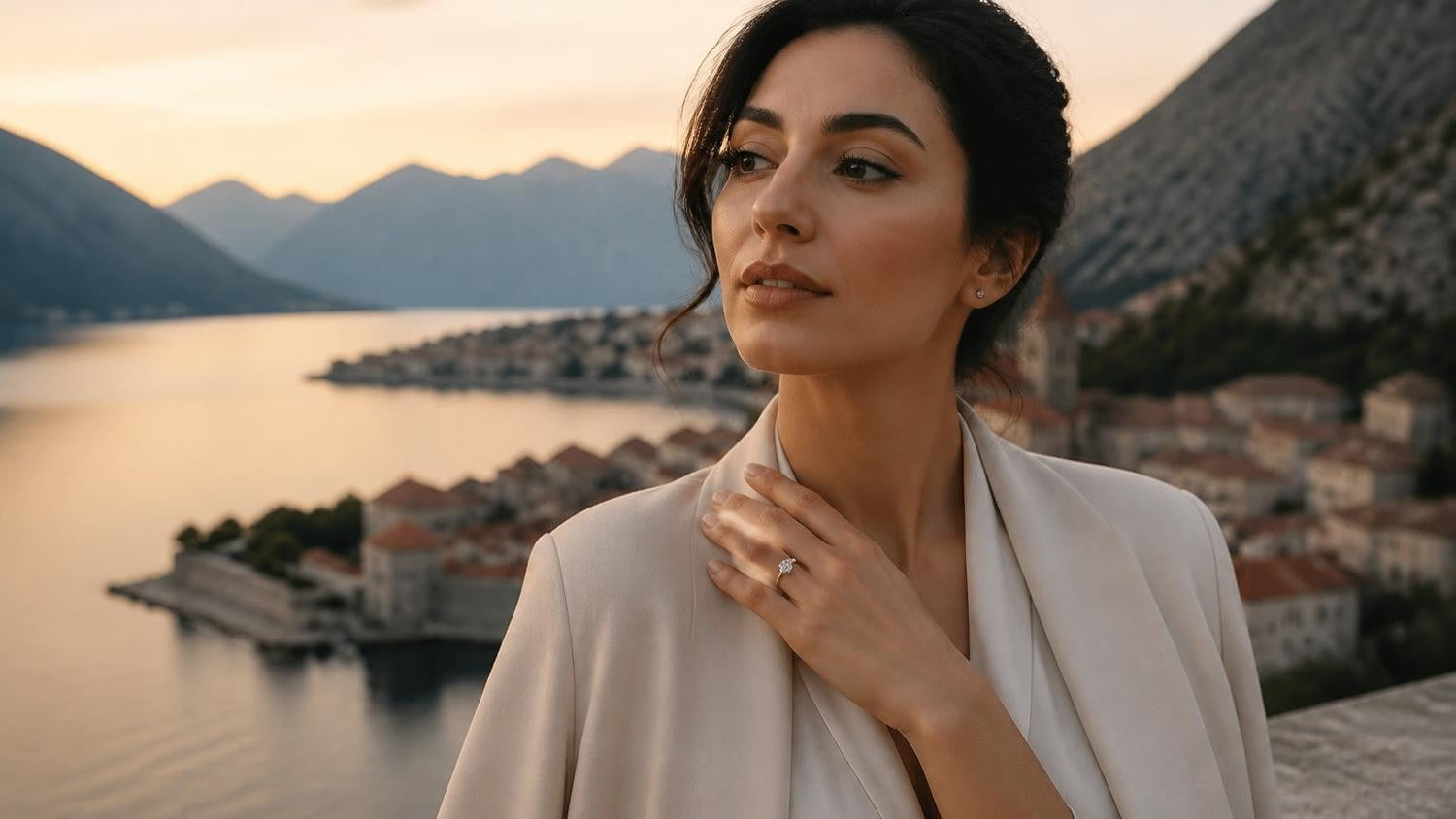Best engagement rings in Montenegro — elegant Montenegrin woman with solitaire ring, Bay of Kotor at dawn