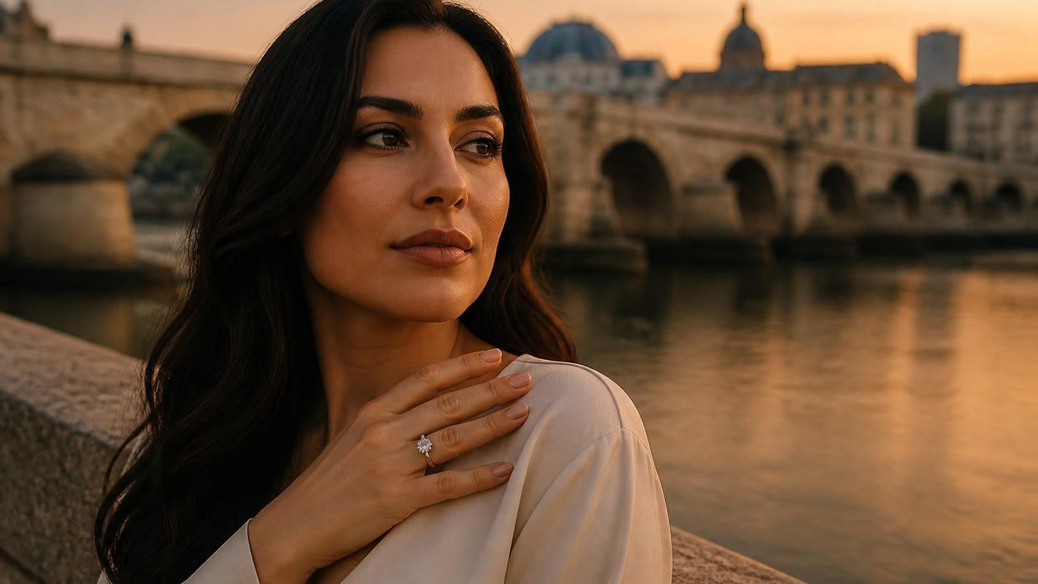Best engagement rings in North Macedonia — elegant woman with ring by Skopje's Stone Bridge at golden hour