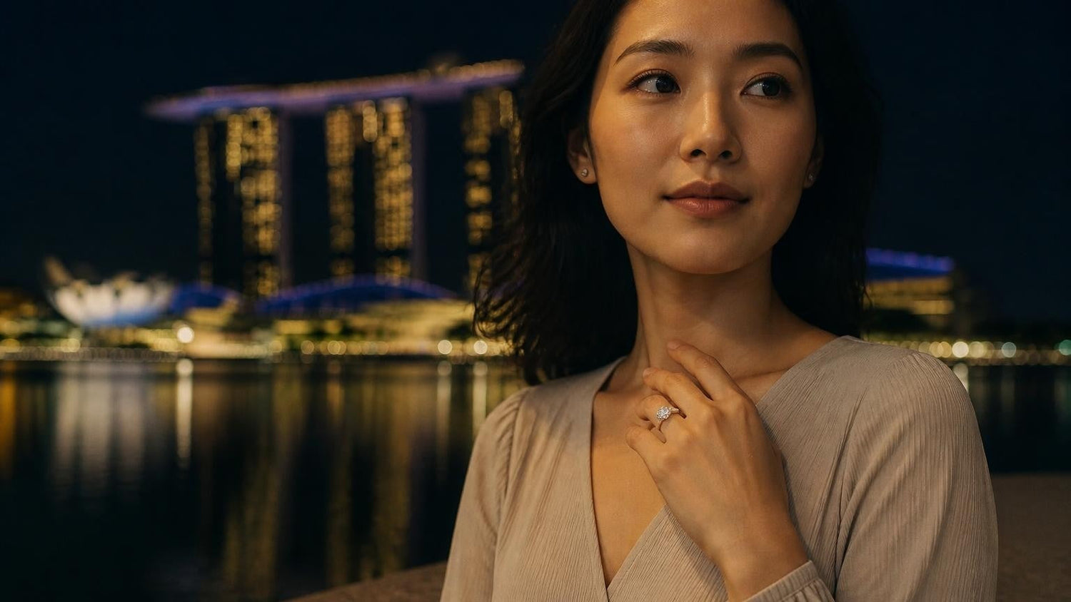 Satéur Destinée Ring™ — elegant Singaporean woman with engagement ring, Marina Bay Sands at golden hour