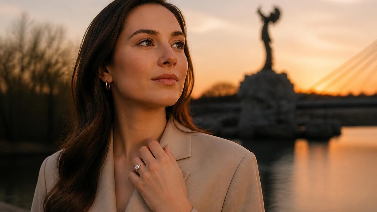 Best engagement rings in Wichita — elegant woman with Satéur Destinée Ring™, Keeper of the Plains at sunset