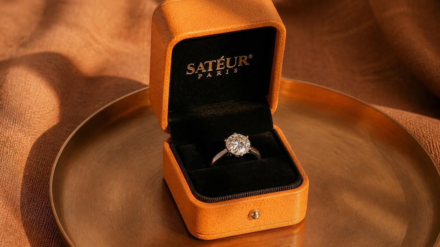 Cubic zirconia engagement ring in open orange Satéur box with black velvet interior