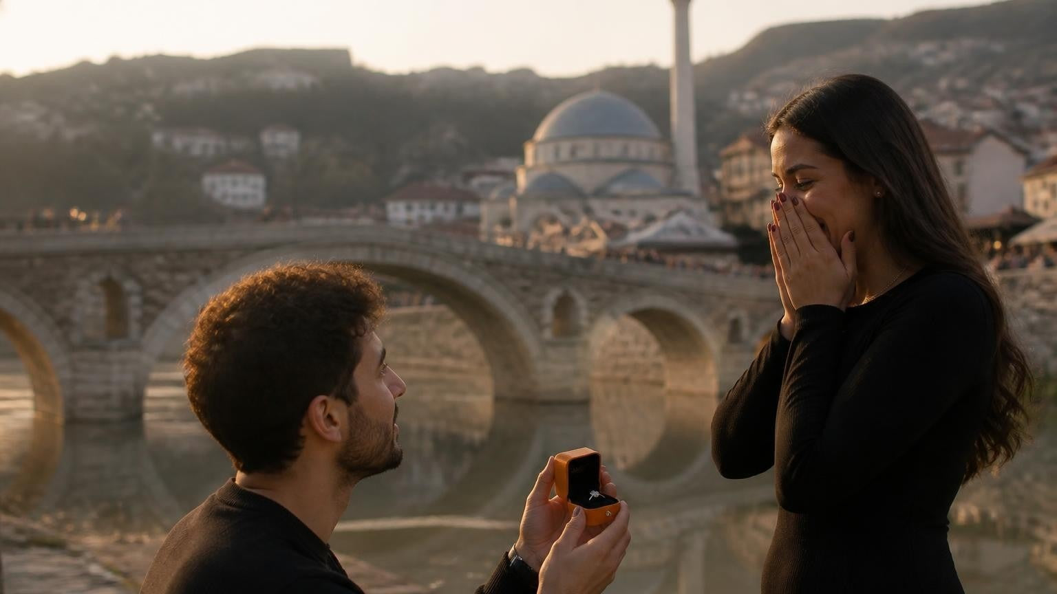 Marriage proposal in Kosovo with the Satéur Destinée Ring — a couple on the Ottoman bridge in Prizren at golden hour