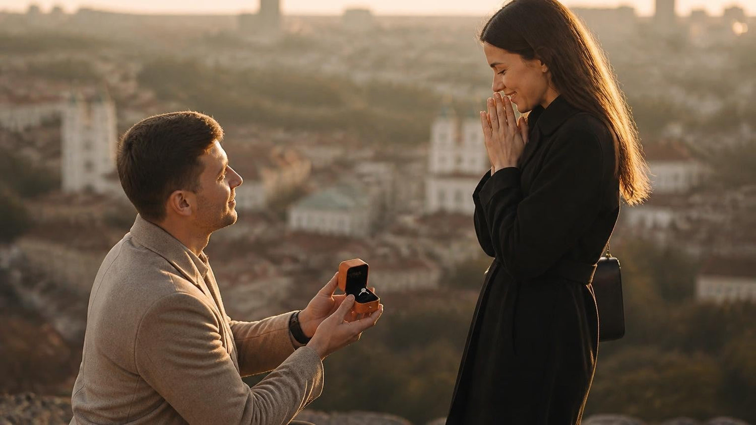 Marriage proposal in Lithuania with the Satéur Destinée Ring — Vilnius Old Town below Gediminas Tower at golden hour