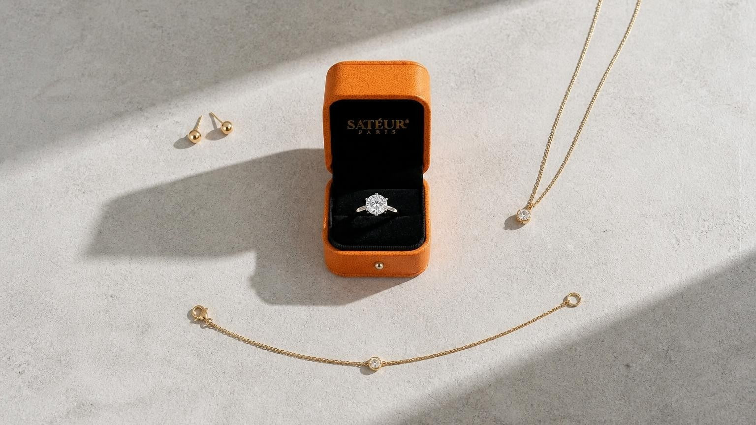 Alternative to Tiffany and Co fine jewelry — Satéur Gems solitaire ring with open orange box