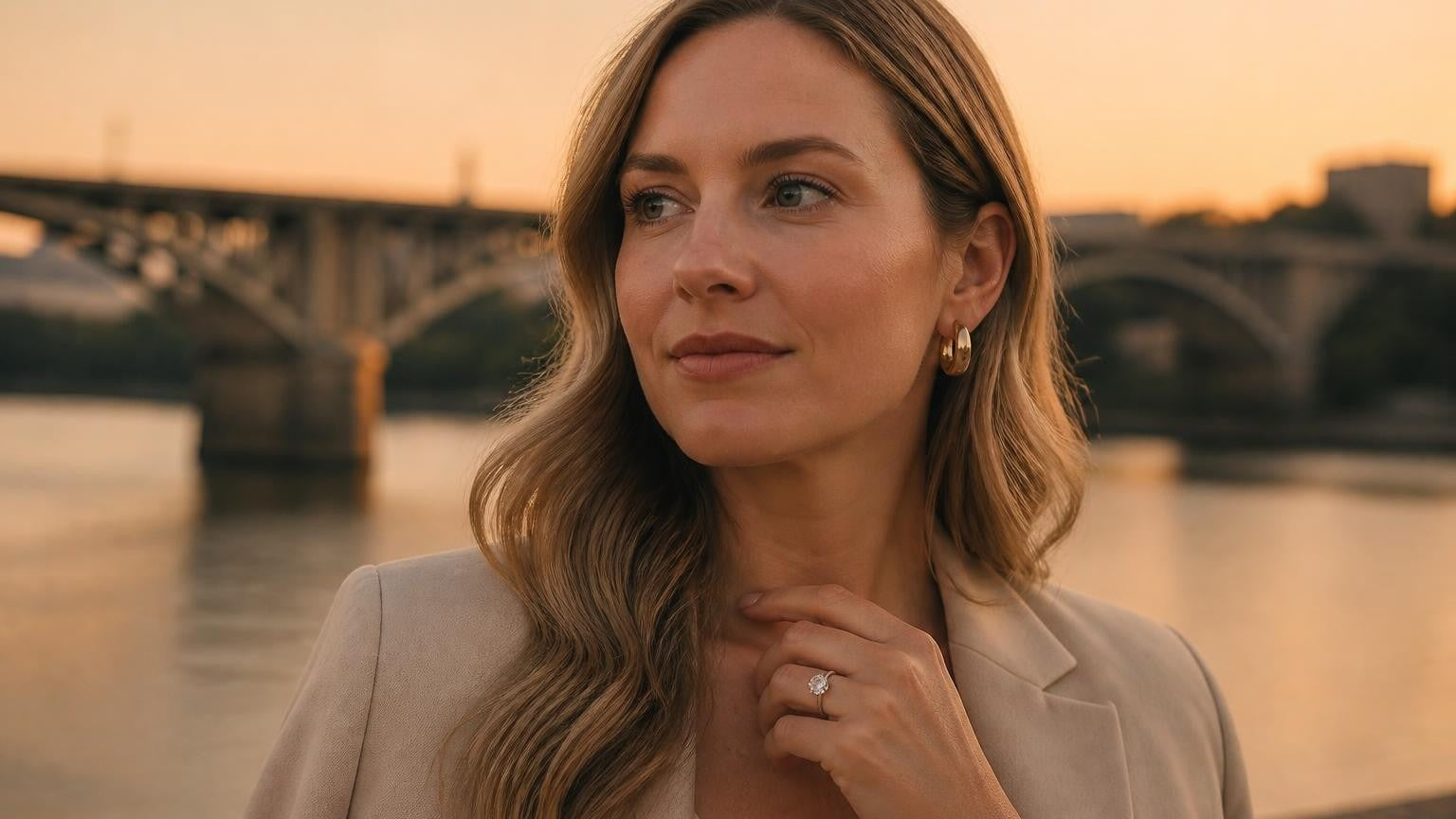 Best engagement rings in Chattanooga — elegant woman with Satéur Destinée Ring, Walnut Street Bridge at sunset