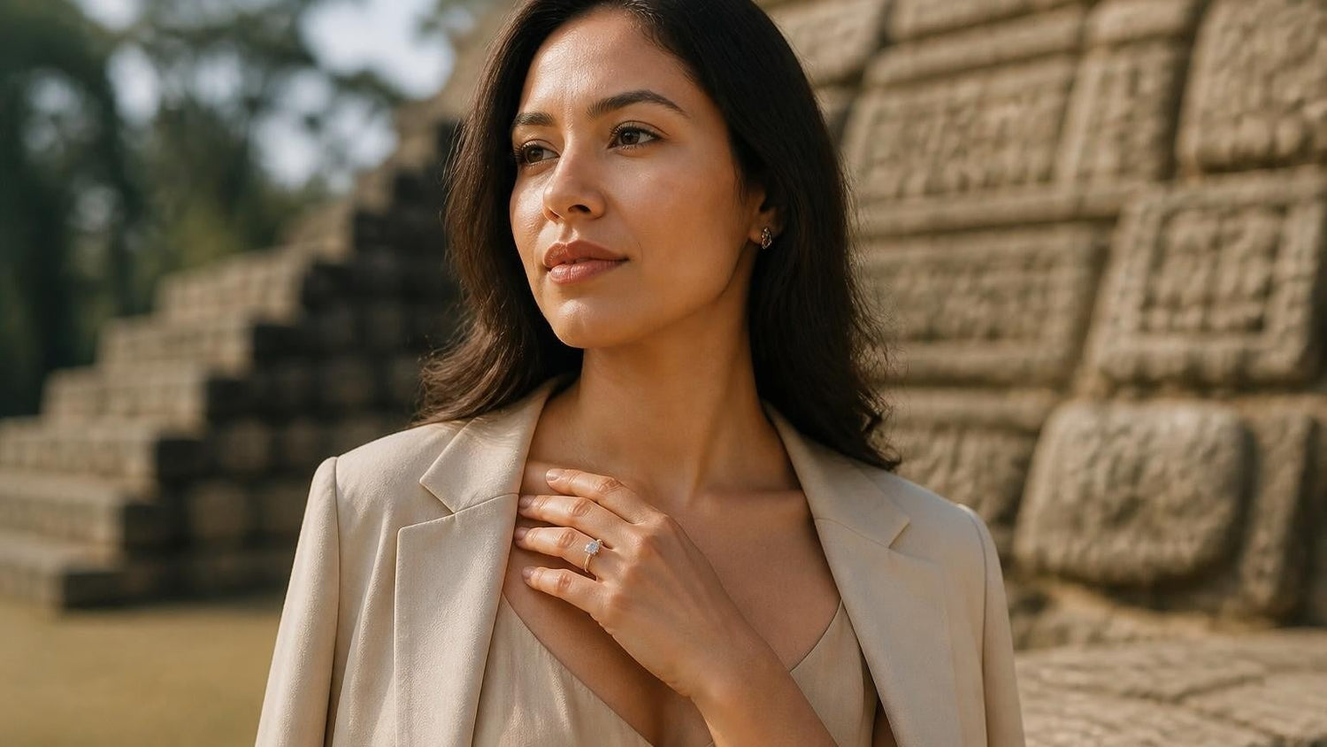 Best engagement rings in Honduras — elegant Honduran woman with solitaire ring, Copán Mayan ruins behind