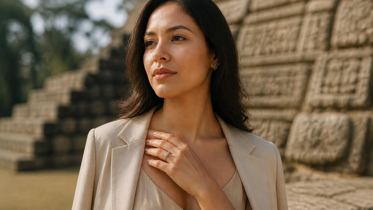 Best engagement rings in Honduras — elegant Honduran woman with solitaire ring, Copán Mayan ruins behind