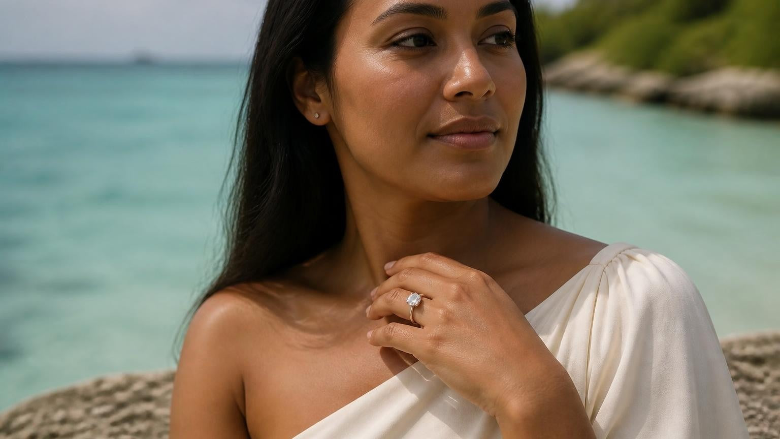 Best engagement rings in Nauru — elegant woman with solitaire ring, Anibare Bay lagoon behind
