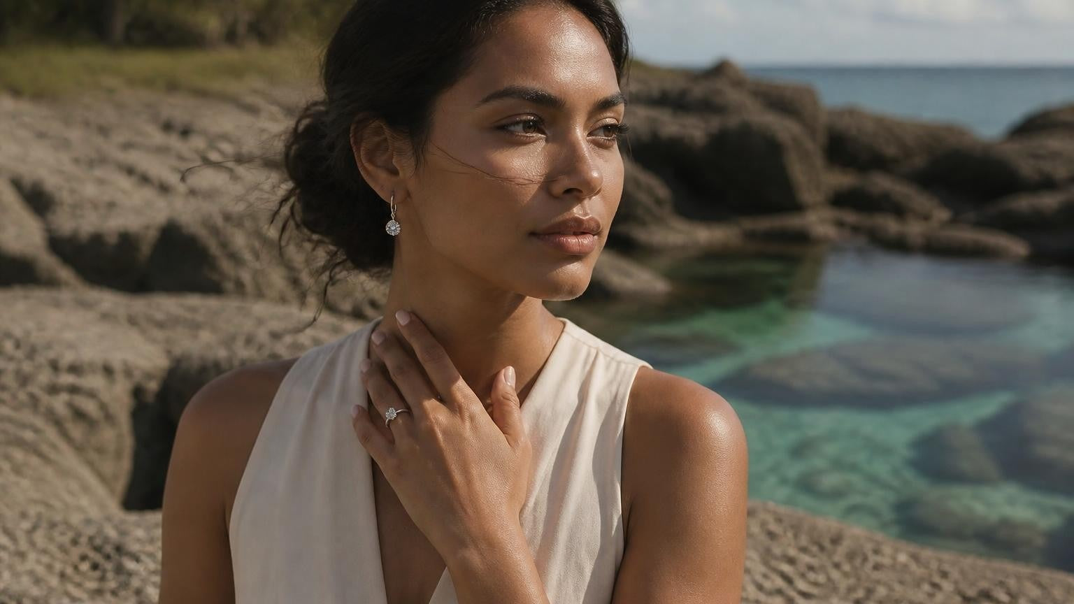Best engagement ring in Niue — Satéur Destinée solitaire ring on Niuean woman against coral coast