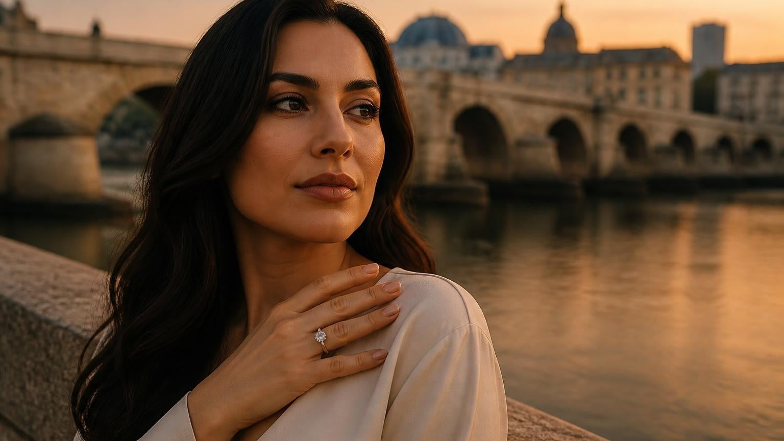 Best engagement rings in North Macedonia — elegant woman with ring by Skopje's Stone Bridge at golden hour