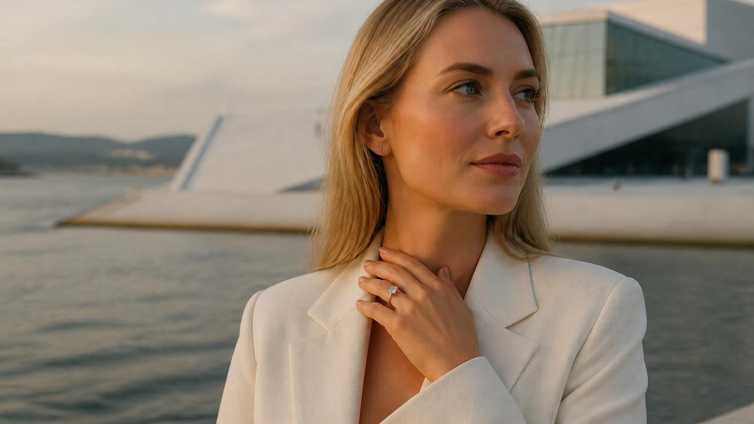 Best engagement rings in Oslo — elegant Norwegian woman with Satéur Destinée Ring, Oslo Opera House behind