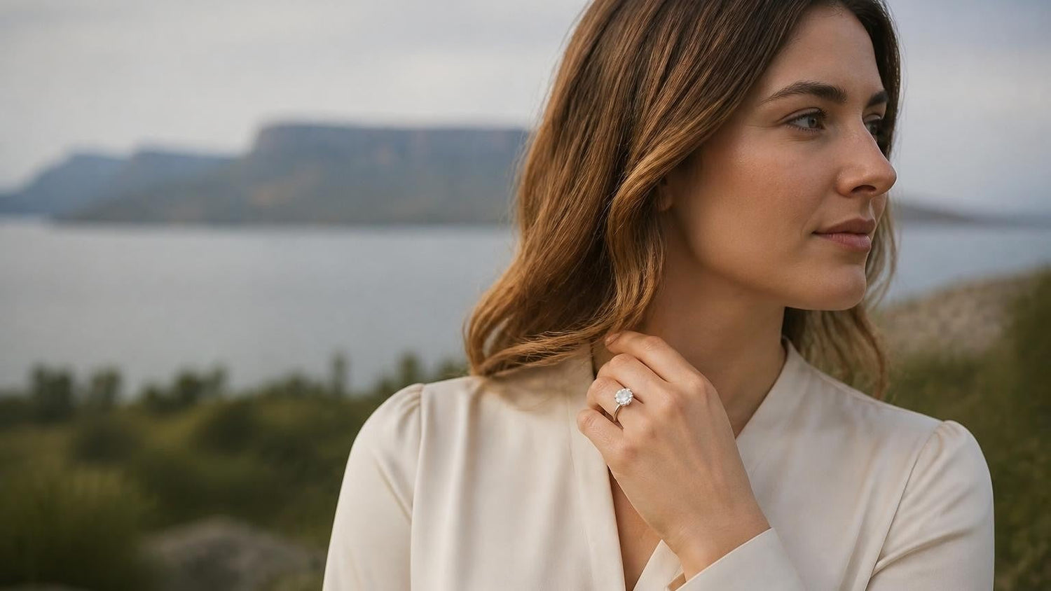 Best engagement rings in Thunder Bay — elegant Canadian woman with Satéur Destinée Ring, Sleeping Giant Provincial Park silhouette