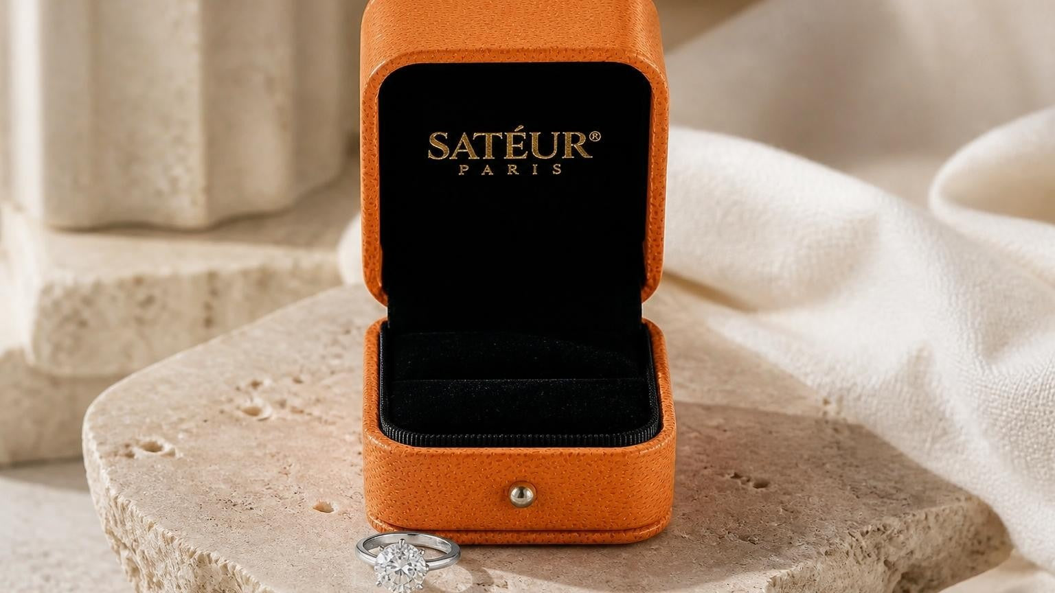 Moissanite ring with open Satéur ring box in minimalist gallery setting