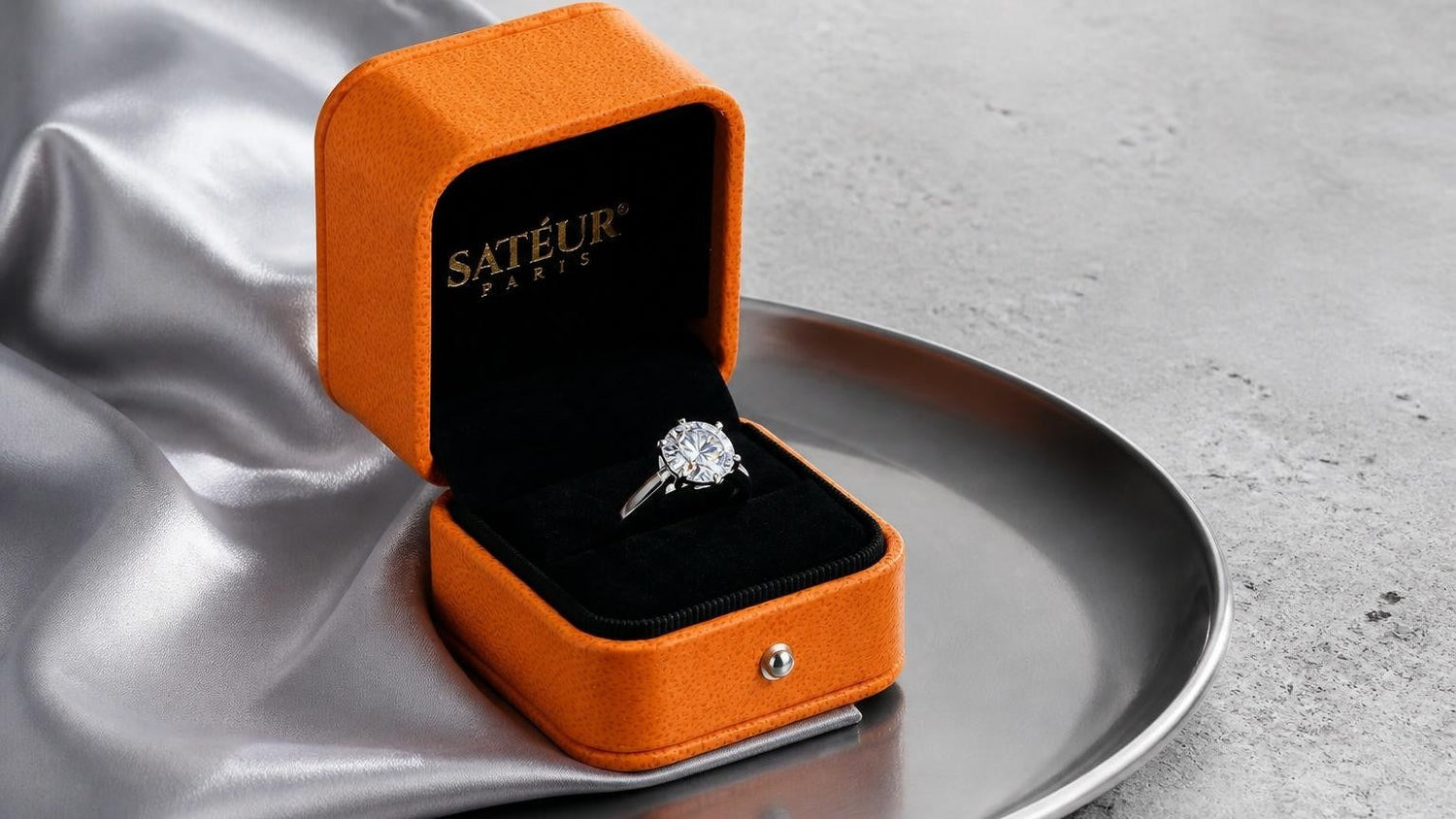 Is moissanite a fake diamond — open Satéur box with moissanite ring showing vivid fire