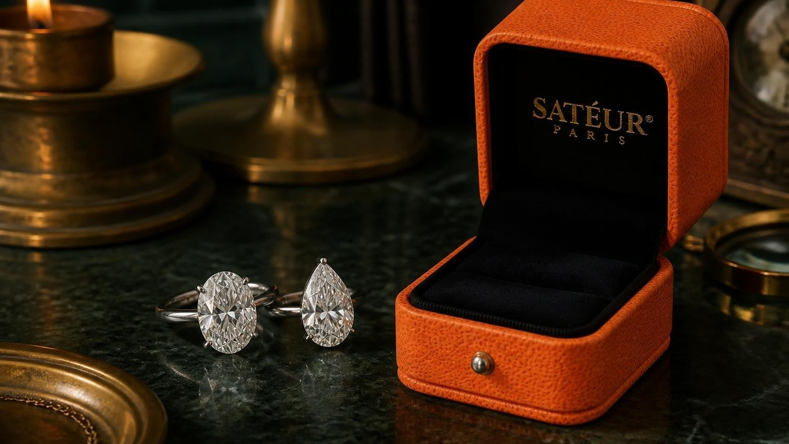 Moissanite oval vs pear shape rings with open Satéur ring box