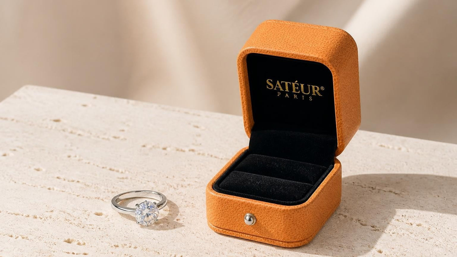 Moissanite price per carat guide — Satéur ring in open orange box