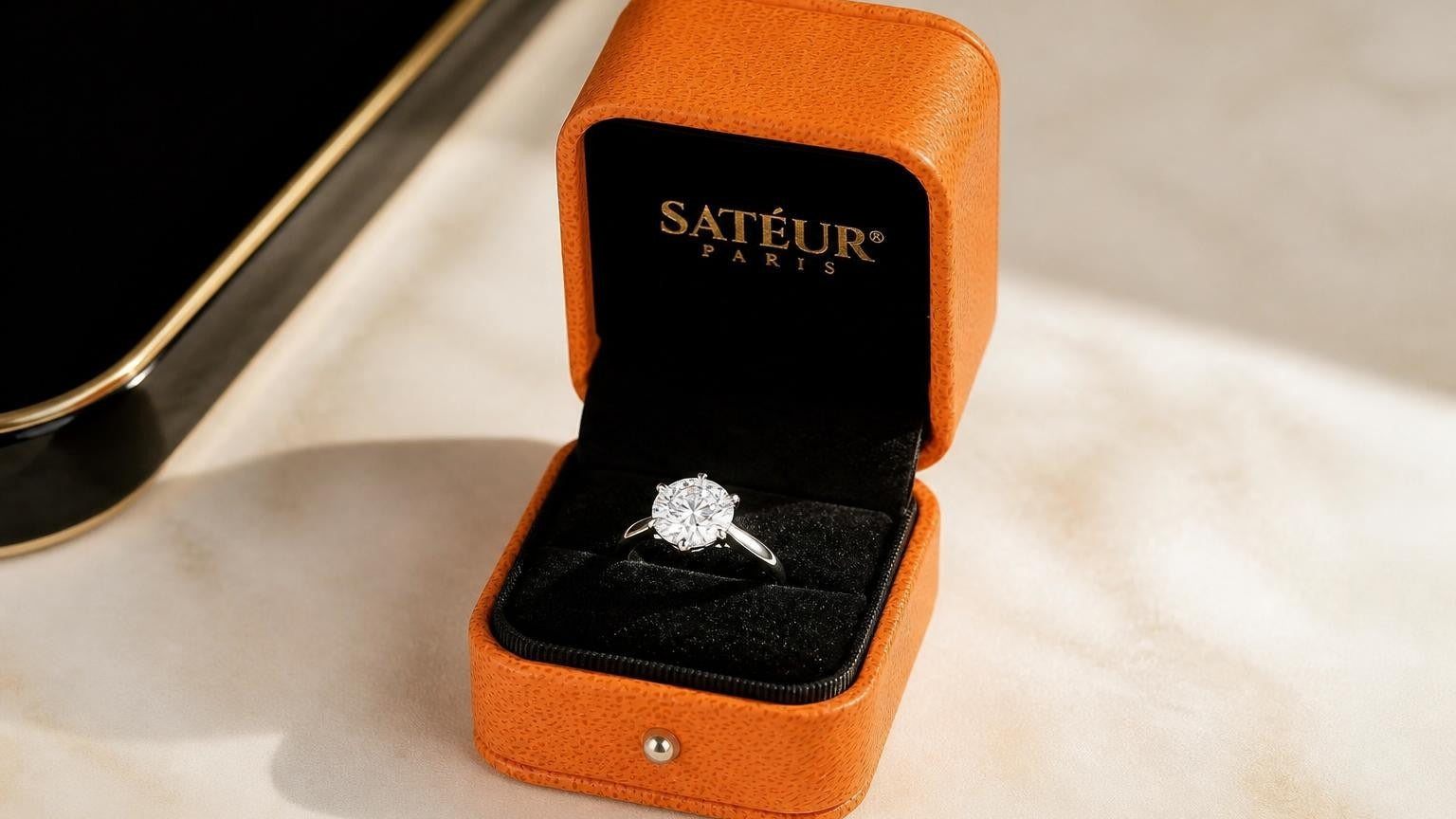 Satéur Destinée Ring in open orange box — real diamond vs diamond simulant comparison guide