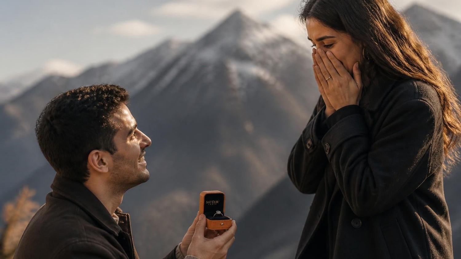 Marriage proposal in Andorra with the Satéur Destinée Ring — a couple at a snow-dusted Pyrenean summit at golden hour